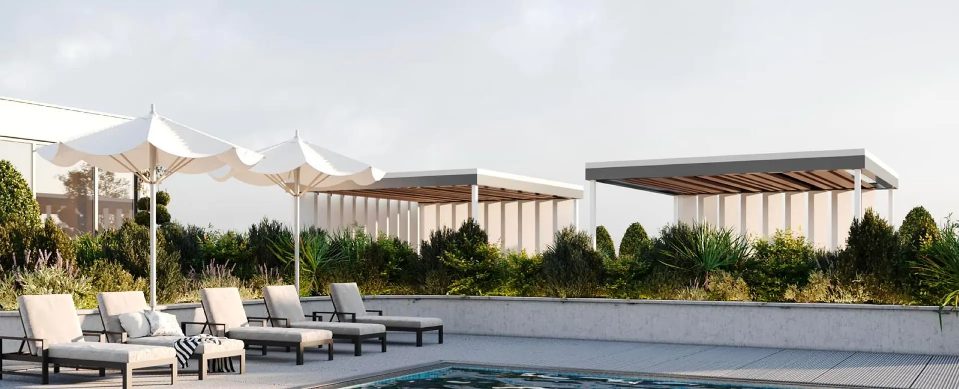 Rooftop pool deck with loungers and pergolas in Dubai